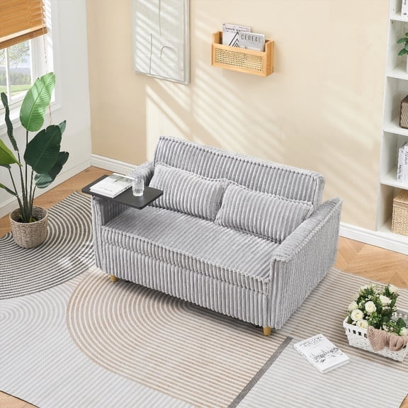 The pull-out and push-in gray corduroy sofa featuring movable tabletops on the armrests, USB ports, and rollers at the bottom, ideal for various rooms.