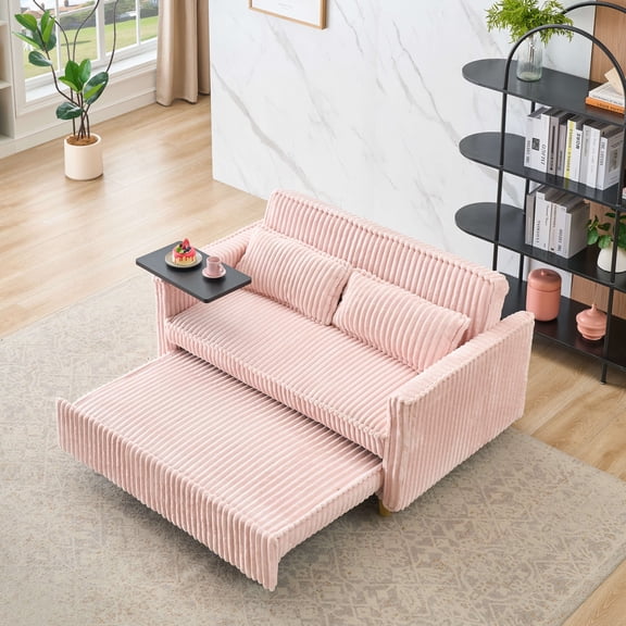 The pull-out and push-in pink corduroy sofa with dual functions, equipped with a movable tabletop and USB ports, is suitable for use in living rooms and bedrooms.
