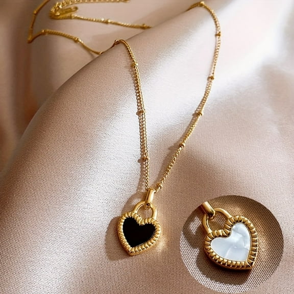 A retro bohemian style necklace made of 14K gold titanium plated steel with a black and white heart-shaped double-sided pendant and a stylish neck bone chain, suitable for daily use and gifting,