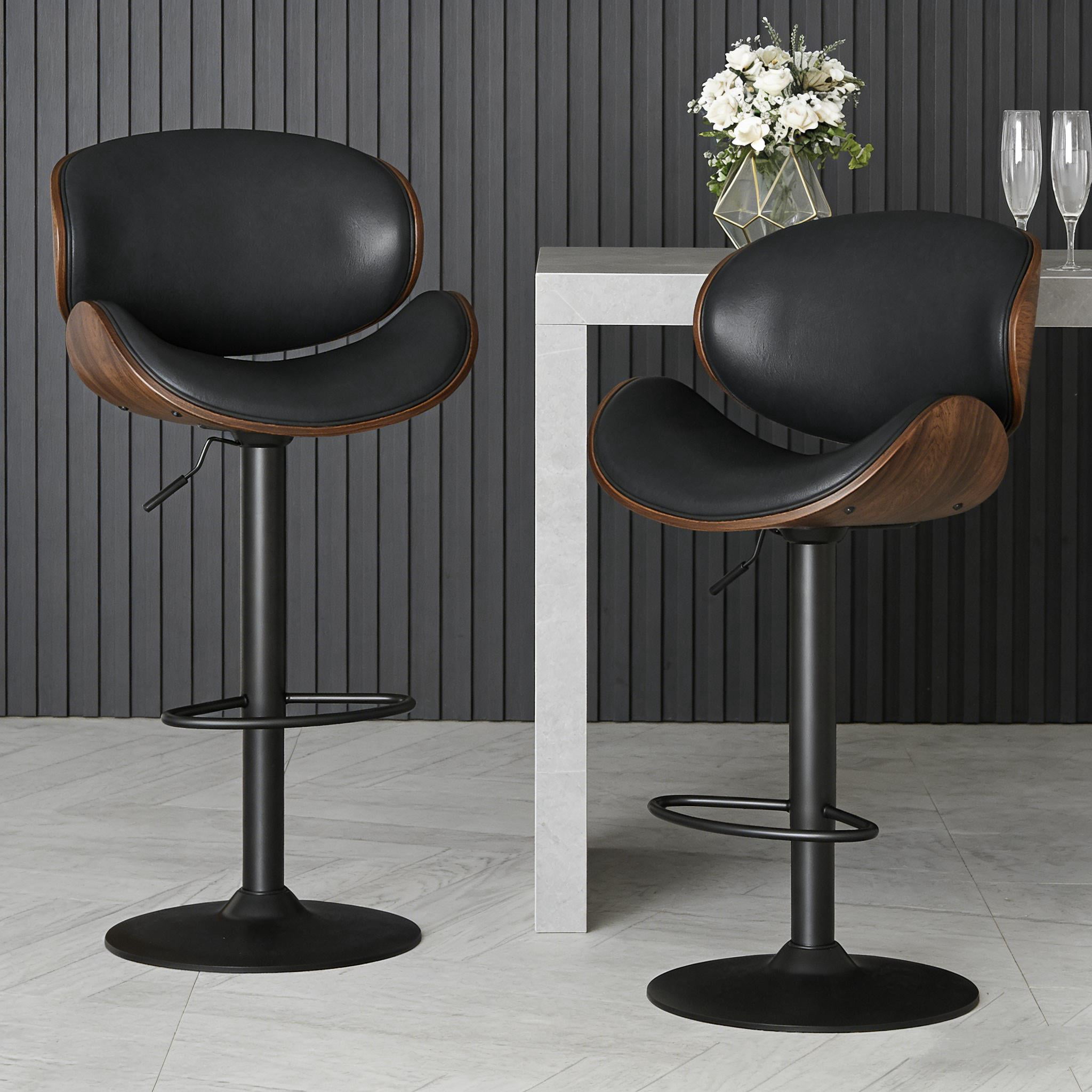 A set of 2 height-adjustable swivel bar stools with PU leather seats and backrests, featuring footrests, suitable for kitchen bar counters or home bars