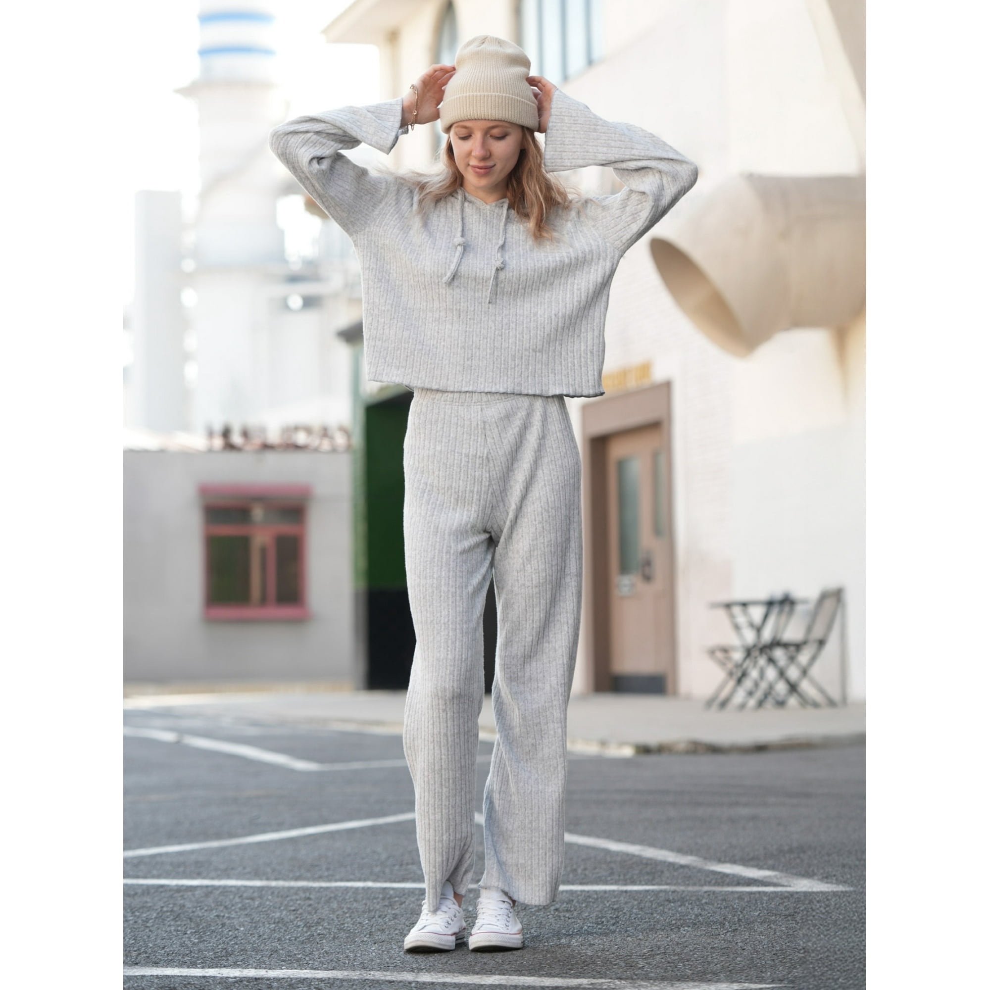 A woman wearing a grey loungewear set