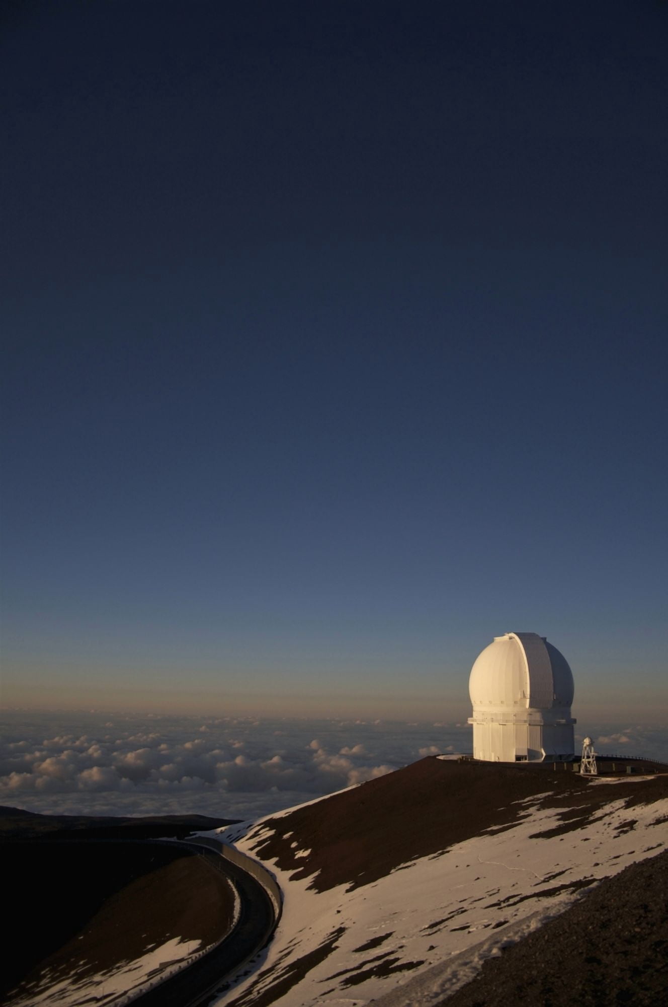 The sun sets over the summit of Mauna Kea and the domed observatories and telescopes Island of Hawaii Hawaii United States of America Canvas Art - James MacDonald Design Pics (12 x 19)