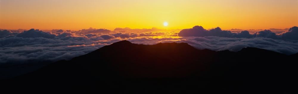 This is sunrise from Haleakala Volcano Summit located at Haleakala National Park These are the cloud formations over the top of the volcano Canvas Art - Panoramic Images (27 x 9)