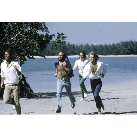 the Bee Gees running at a beach Photo Print (30 x 24)