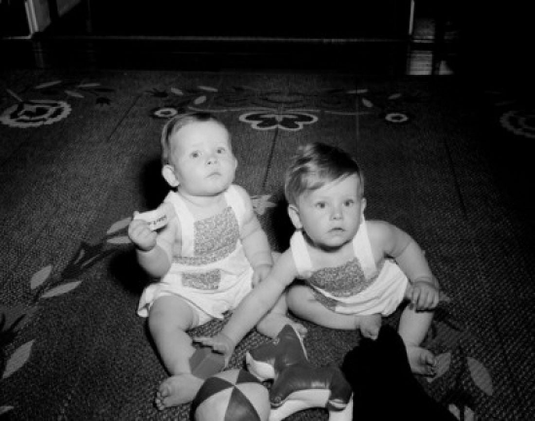 two baby girls sitting on floor and watching tv Canvas Art - (24 x 36)