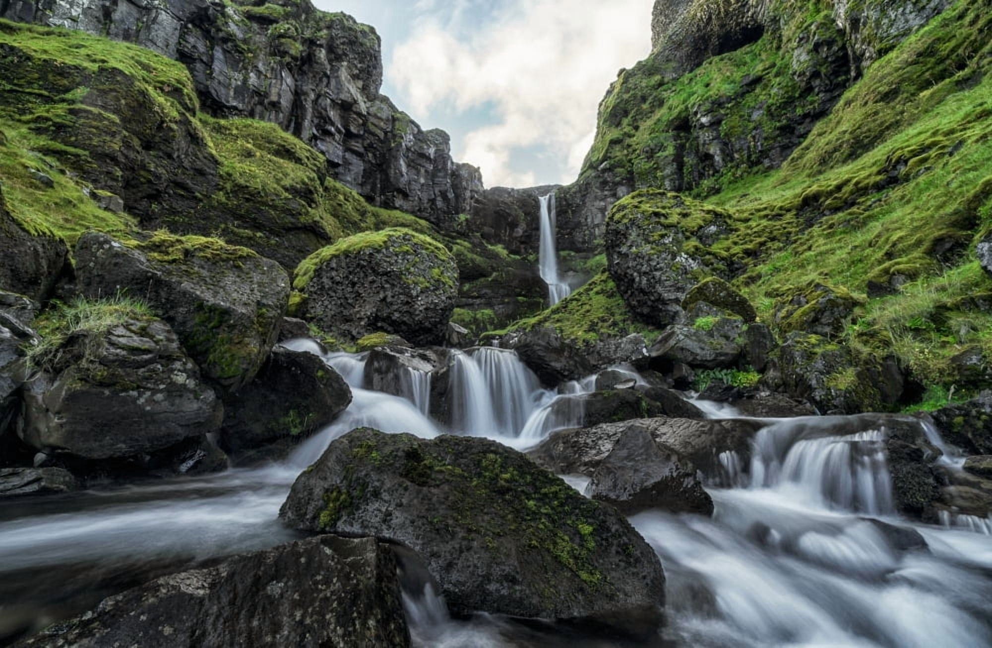 An unnamed stream flows over a cliff face creating a beautiful waterfall after a period of heavy rains Iceland Canvas Art - Robert Postma Design Pics (38 x 24)