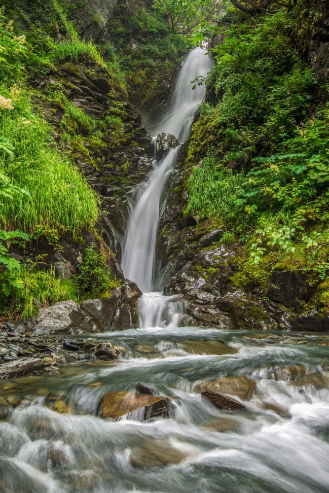 An unnamed waterfall flows down a series of drops in the mountains near Valdez Alaska United States of America Canvas Art - Zachary Sheldon Design Pics (12 x 19)