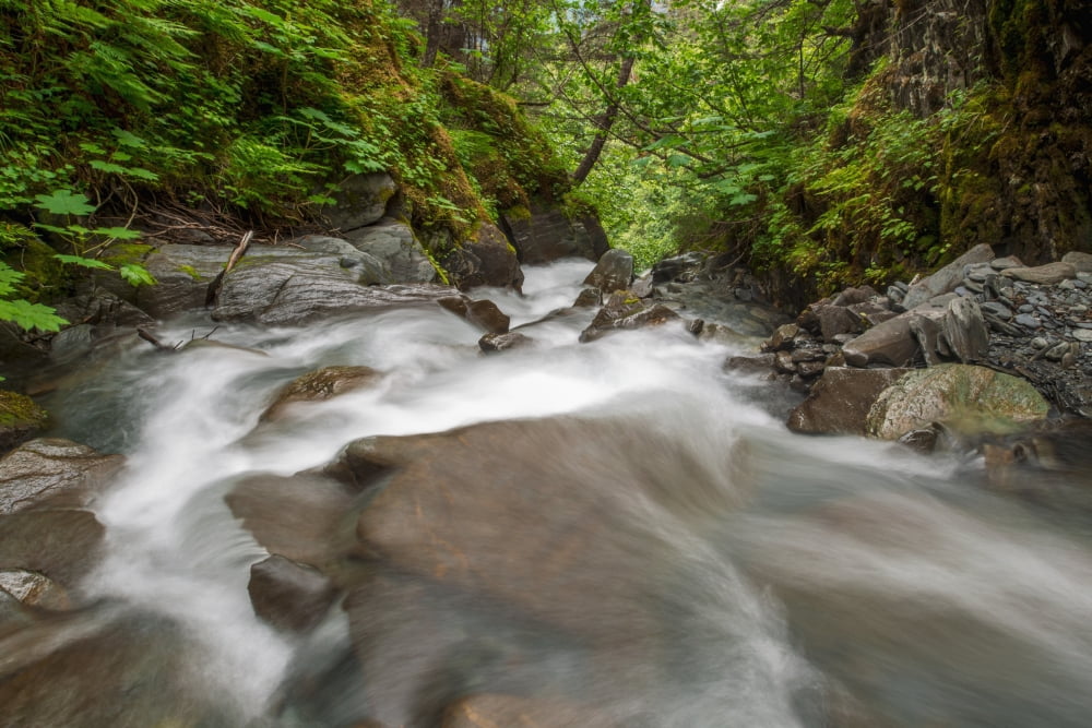 An unnammed creek near Valdez rushes through a narrow canyon before plunging over a large drop Alaska United States of America Canvas Art - Zachary Sheldon Design Pics (38 x 24)