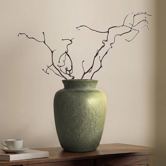 This vintage matte green ceramic vase features a smooth, glazed finish with a minimalist jar shape. It measures 2.76" in opening diameter, 4.72" in width, and 6.30" in height, perfect for dried flowe