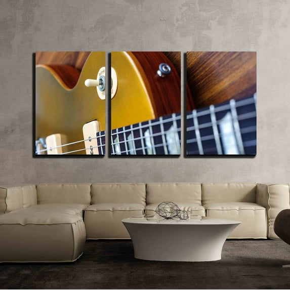 wall26 - 3 Piece Canvas Wall Art - Vintage Gold Top Single Cutaway Guitar on Wood Surface - Modern Home Art Stretched and Framed Ready to Hang - 16"x24"x3 Panels