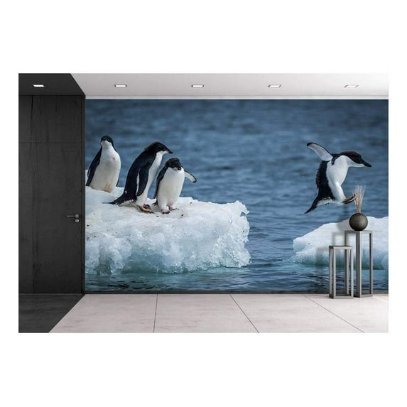 wall26 - Adelie Penguin Jumping Between Two ice floes - Removable Wall Mural | Self-Adhesive Large Wallpaper - 66x96 inches