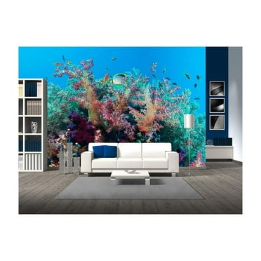wall26 - Colorful Underwater Offshore Rocky Reef with Coral and sponges and Small Tropical Fish Swimming by in a Blue Ocean - Removable Wall Mural | Self-Adhesive Large Wallpaper - 100x144 inches