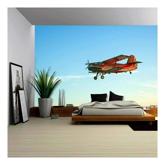 wall26 - Red Vintage Airplane Flying Against Blue Sky - Removable Wall Mural | Self-Adhesive Large Wallpaper - 100x144 inches