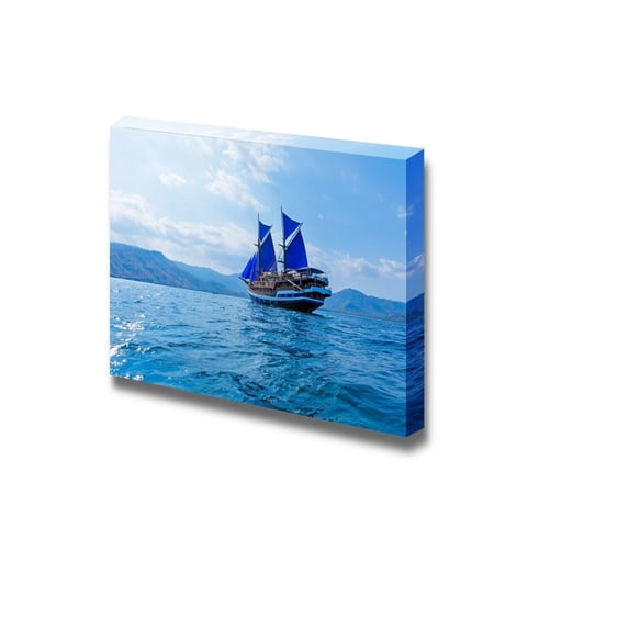 wall26 Vintage Wooden Ship with Blue Sails Near Komodo Island Indonesia - Canvas Art Wall Art - 24" x 36"